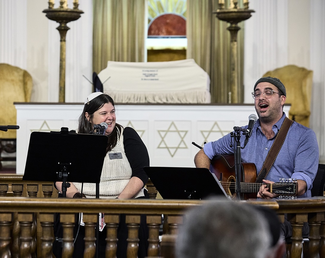 Rabbi Jessy Dressin and Ami Yaris sing on the bima at Third Space